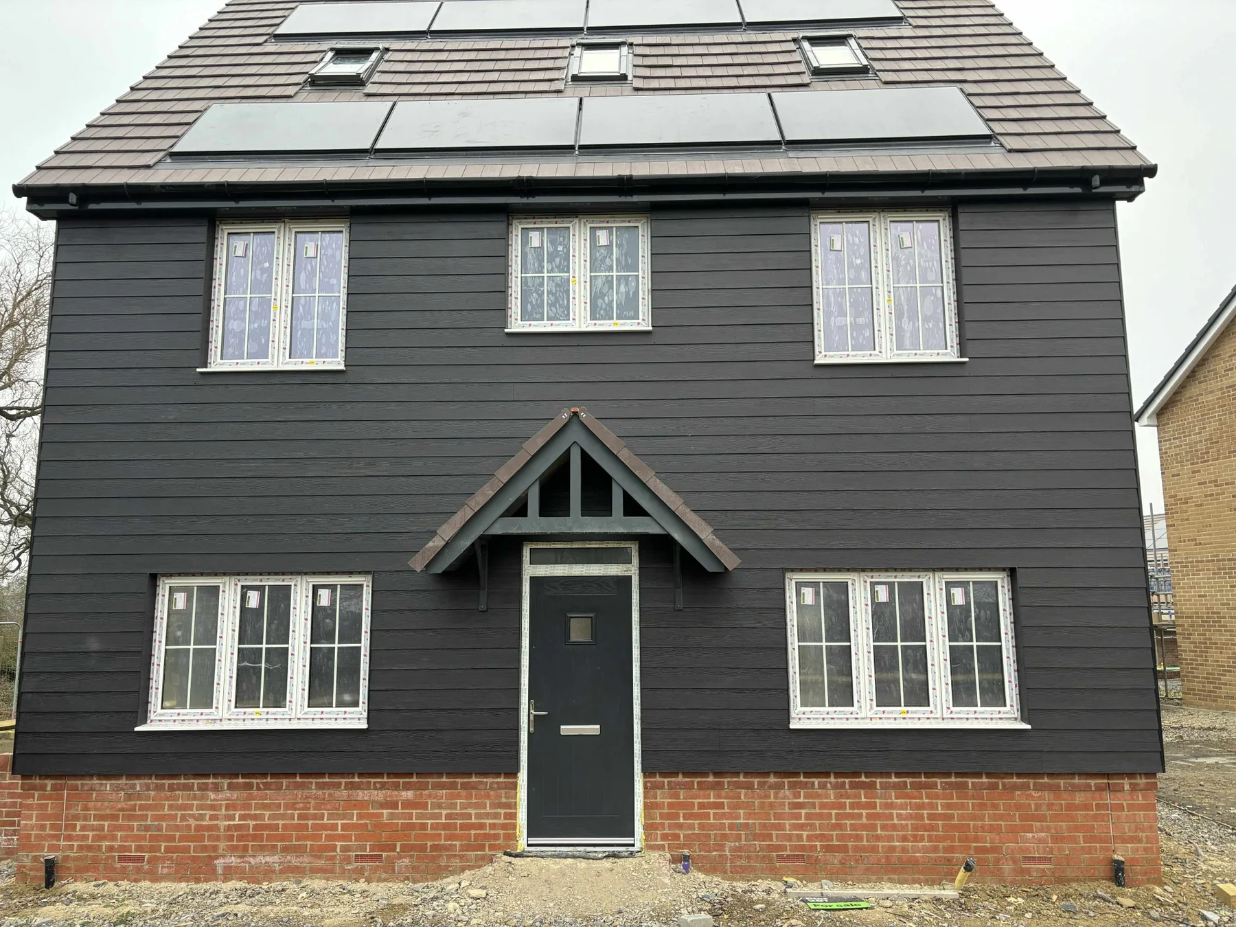 Black weatherboard cladding on residential property