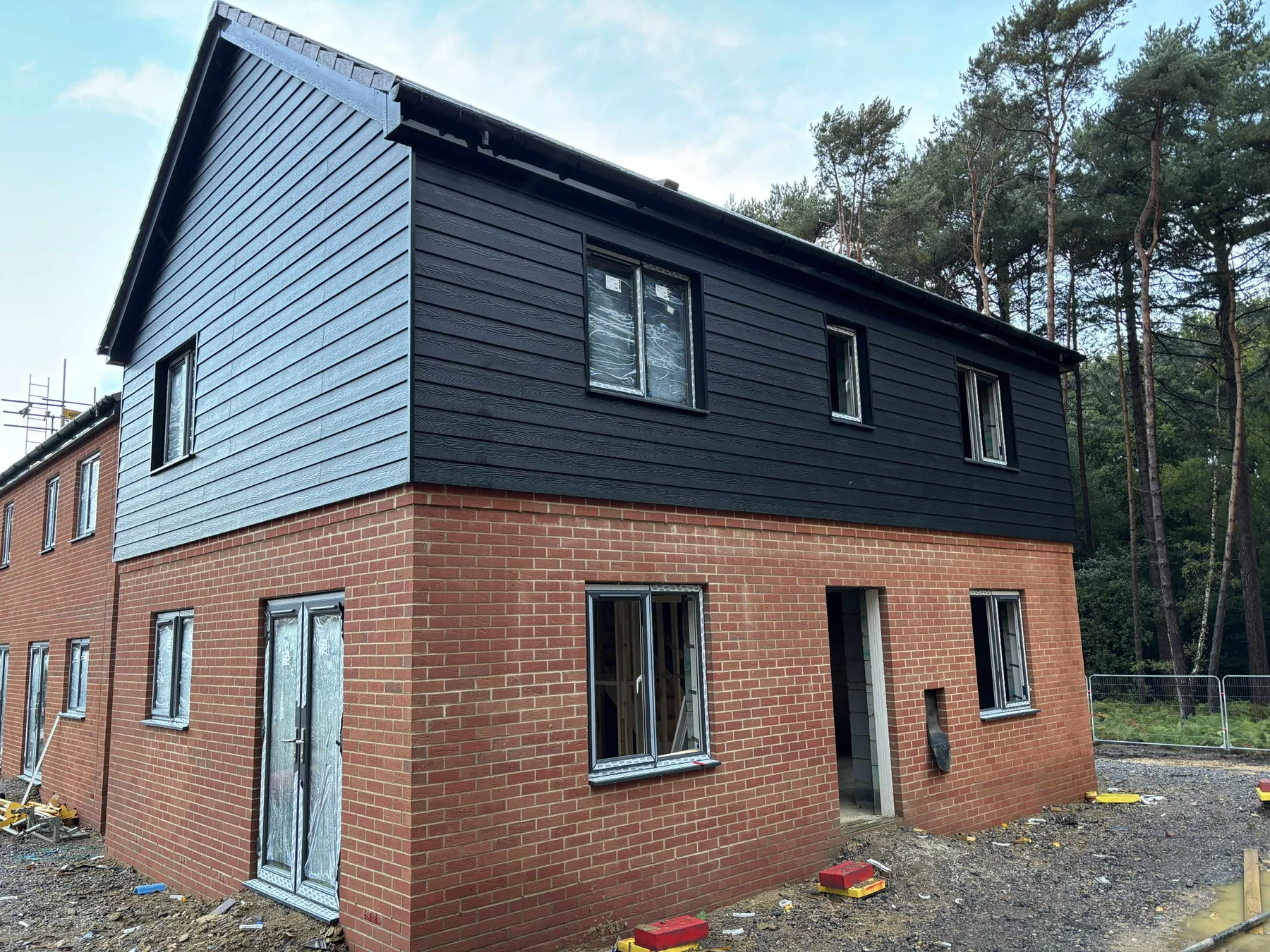 Black weatherboard side facade