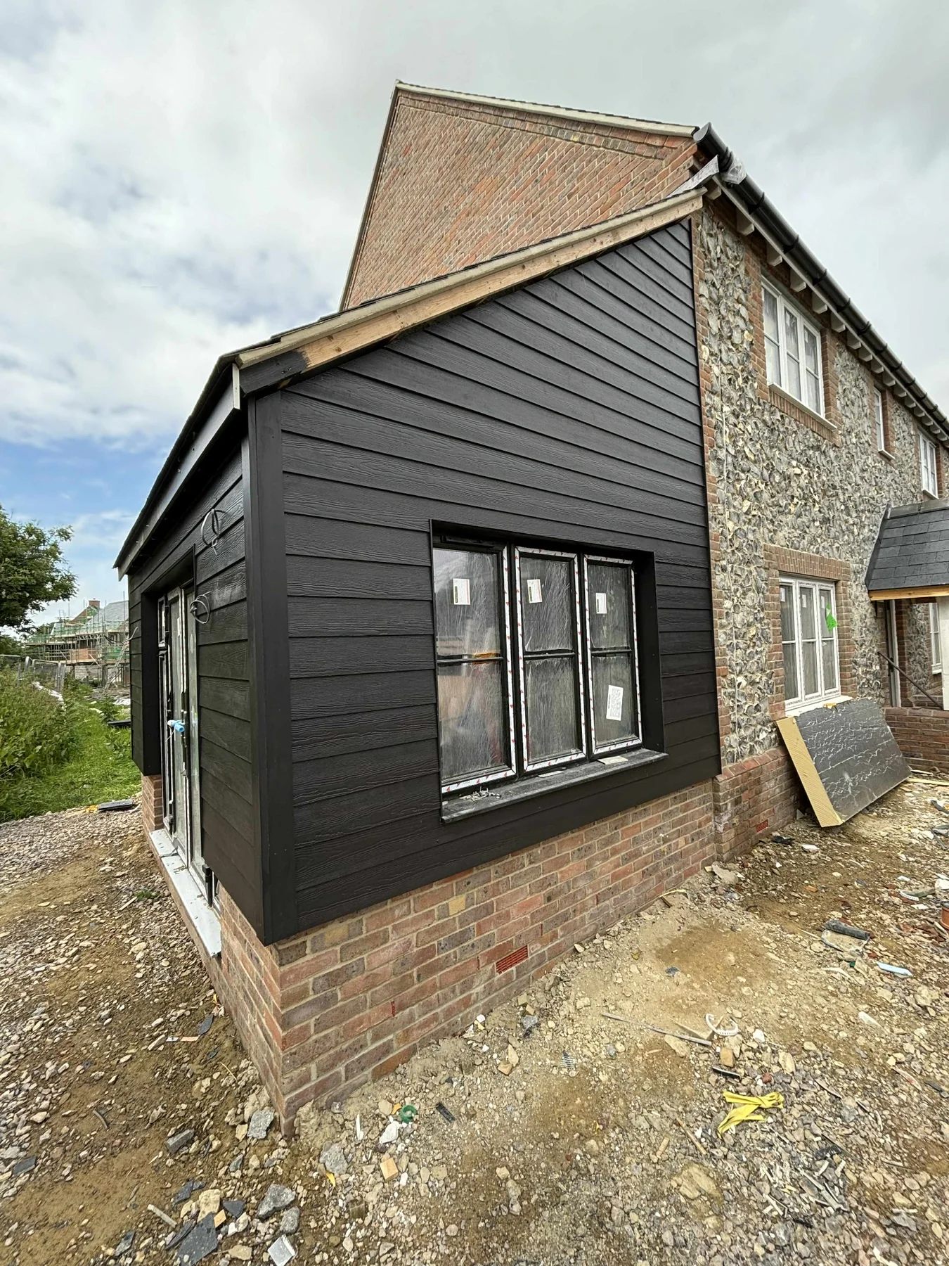 Dark side extension cladding