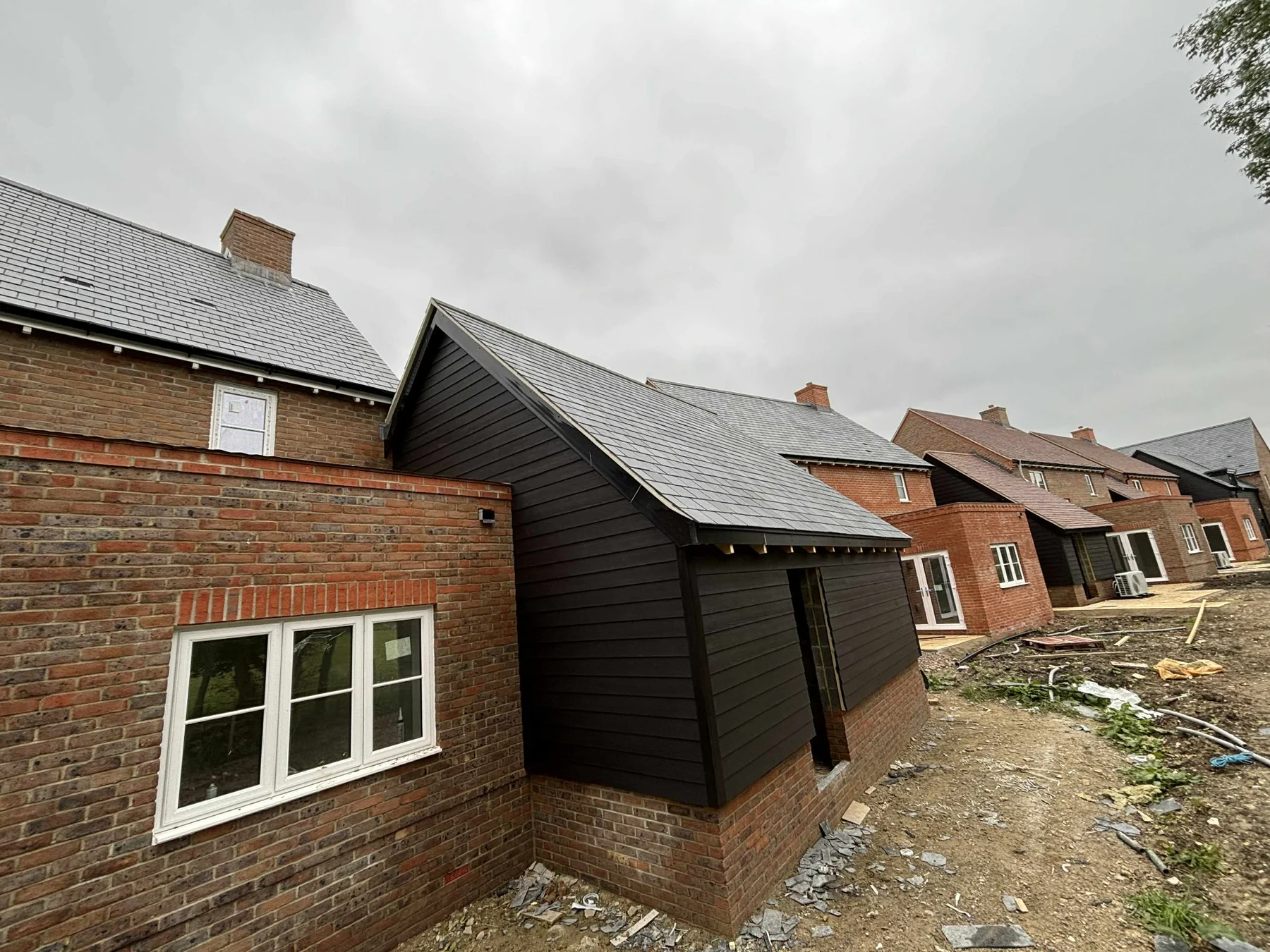 Row of homes with black cladding