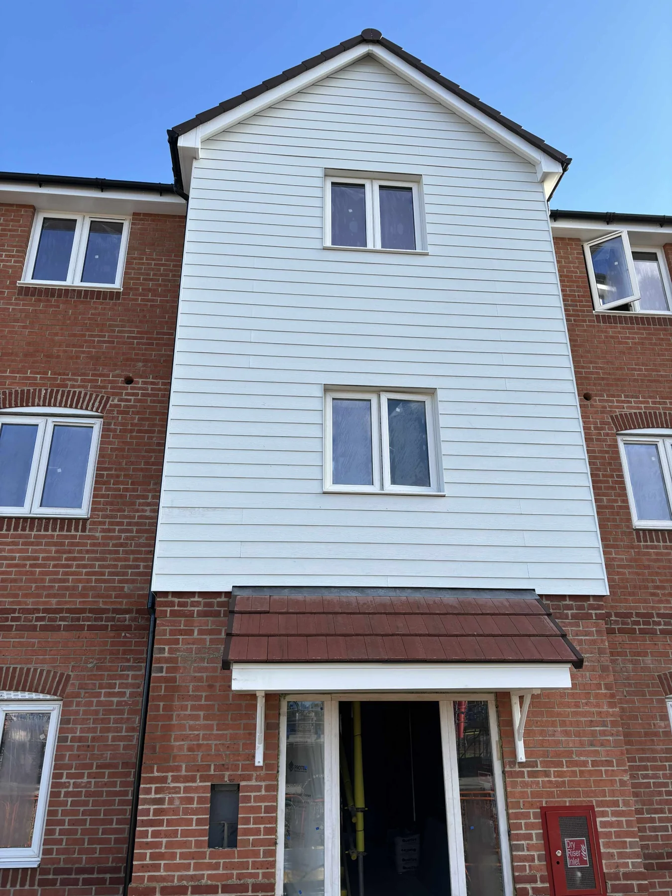White weatherboard cladding on residential property